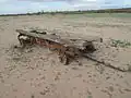The remains of a farm wagon in an abandoned field near Quail Creek