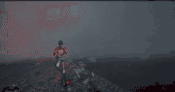 A boy walks in smoke and enters a dirty elevator.