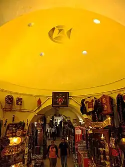 Interior of the Orhan Bey Hamam in Bursa (c. 1339), currently used as a market (the Eski Aynalı Çarşı)[80]