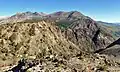 Parker Peak seen from Rush Creek Trail near Spooky Meadow on Carson Peak. Parker is the reddish peak centered in the distance.