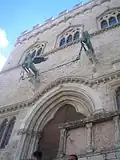 A Griffin and a Lion, symbols of the city, decorate the entrance from Piazza della fontana