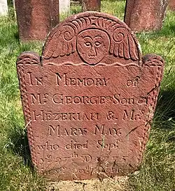 A marker dated 1775 carved by Peter Buckland of Manchester, made of brick red brownstone from the Buckland Quarry in Manchester.