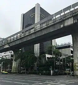 Tall skyscraper behind elevated highway