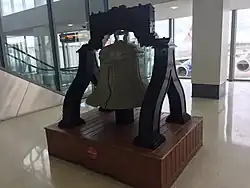 A replica of the Liberty Bell built with LEGO bricks in Terminal A West