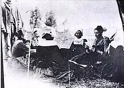 1887 photographic study of the group, including the standing men.[7]