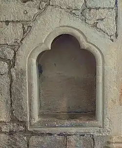 C15 piscina in St. Katherine's chapel inside Sherborne Abbey, Dorset, England. May 2025.