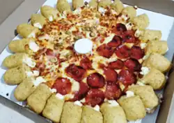 Half pepperoni, half Brazilian (ham, olives and requeijão) pizza with cream cheese-filled seasoned bun crust, from Pizza Hut