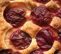 Cake topped with whole plums