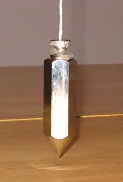 Image 32A plumb bob determines the local vertical direction (from Gravity of Earth)