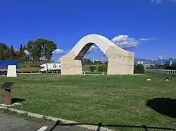 The arch-sculpture PortaRoma nearby the highway entrance at Fiano Romano
