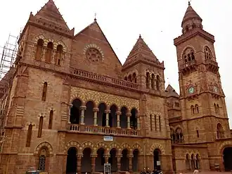 Italian Gothic architecture of Prag Mahal with clock tower on right