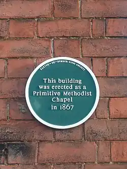 Blue plaque erected on the building by the Barton Civic Society