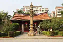 Stone Dhvaja stands in front of the Hall of Manjushri.