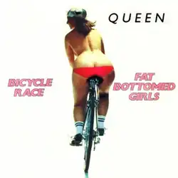 Rear view of a woman, wearing only a thong which partially exposes her buttocks, riding a bicycle against a white background. On the top right in black text is the band's name; the song's name is on the left side in pink text, while "Fat Bottomed Girls" is on the right.
