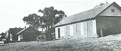 The residence (left) and the garage (1930s).