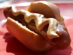 Thüringer Rostbratwurst in a bun with mustard