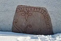Runestone immured in the church porch