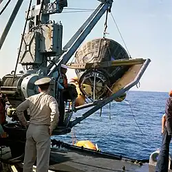Gemini 8 capsule being hoisted aboard Leonard F. Mason on 16 March 1966