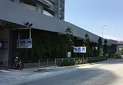 Entrances to the park and ride facility (right) and the drop-off lay-by (left) at Persiaran Bandar Utama.