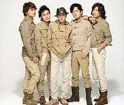 Five men standing in a line