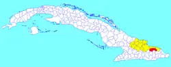 Sagua de Tánamo municipality (red) within Holguín Province (yellow) and Cuba