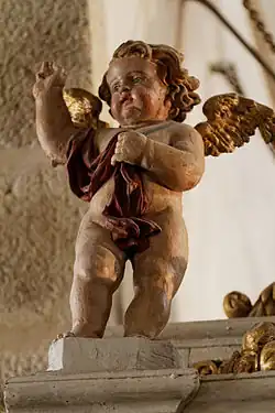 Cherub decorating the baroque pulpit at the Notre-Dame church at Saint Thégonnec