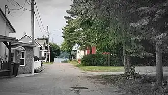 View of Tessier street in Sainte-Thècle (Quebec) from the intersection of Masson street in July 2021.