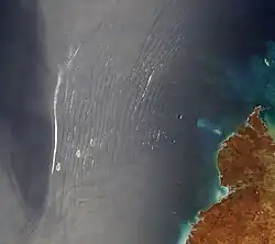 wave clouds observed over the ocean, seen from a satellite