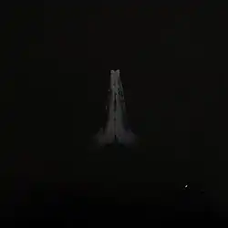 A black cover with a photograph of two black hands praying