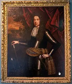 A 3/4-length painted portrait of Donough MacCarty, probably 2nd Viscount Muskerry at the time, showing a clean-shaven man with long curly hair or such a wig, wearing a lace jabot and clad in armour with a yellow sash with two tassels around his waist, standing in front of some drapery opening on a distant landscape with a palace and a French garden in front of it