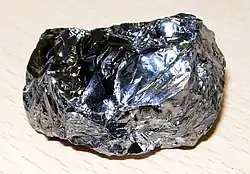 A lump of black reflective metal