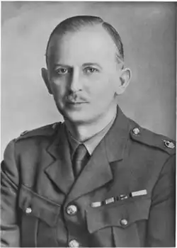 Casson, a middle-aged man in military uniform, wearing three medals and a major's rank. One is overlaid with the oak leaf denoting a mention in despatches.