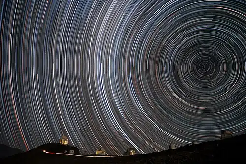 Image 44Starry circles arc around the south celestial pole, seen overhead at ESO's La Silla Observatory. (from Earth's rotation)