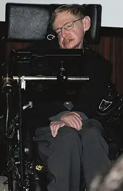 Stephen Hawking sitting in his wheelchair inside