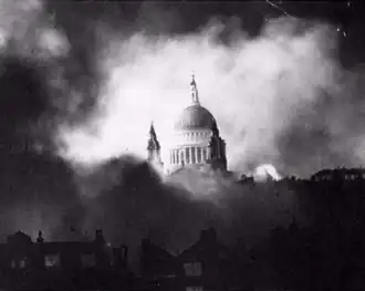 Black and white image of St Paul's Cathedral while London burns