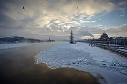 Sunset over an ice-covered Neva River