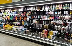 large variety of beer for sale on supermarket shelves