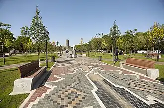 Paving adorned with motifs from the “Guhar” dragon carpet