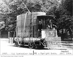 Sprinkler car with upright water tank