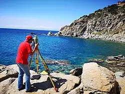 Image 10Surveyor using a total station (from Geomatics)