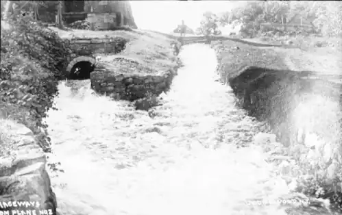 Tailrace of Plane 2 East. Water from the turbine comes out from the left. Water on the right is from the bypass flume.