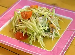 A variation of the salad with green mango instead of papaya and dried anchovies (tam mamuang pla haeng thot)