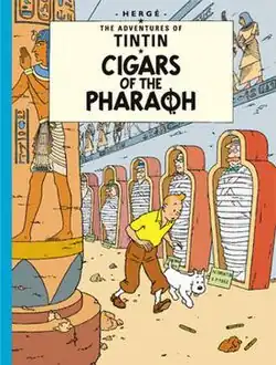 Tintin and Snowy are following a trail within an Egyptian tomb.