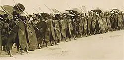 Azande, warriors of the Bomokandi region, showing off in Manziga's village, near Niangara, c.1900-1918