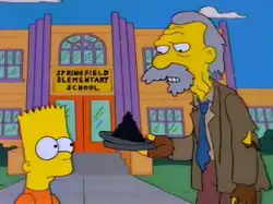 A cartoon image. A young boy looks at an older man holding a film canister with ashes in it.