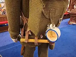 Life-size soldier showing backpack and tea stained mug