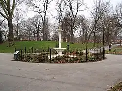 Fountain surrounded by railings in a park