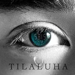 The cover art for "Tilaluha": A close-up photograph of a man's eye with a blue iris in tears. Its surrounding area is captured in grayscale. The song title, "Tilaluha", is superimposed below the eye, while the band's name is inscribed on the eye.