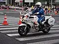 A Tokyo Metropolitan Police Department motorcycle officer on a Yamaha FJR1300 during the 2015 Tokyo Marathon