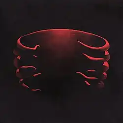 Cover art for Undertow, featuring a red 3D model of a ribcage designed by Adam Jones